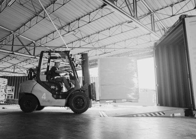 truck lifting goods at Sax Lift